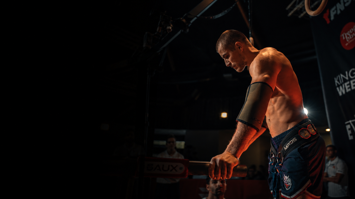 MPDS athlete with dip belt and elbow sleeves at a streetlifting competition