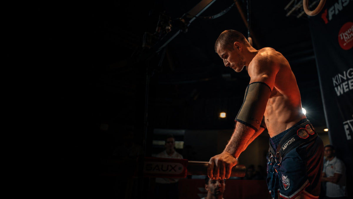 MPDS athlete with dip belt and elbow sleeves at a streetlifting competition